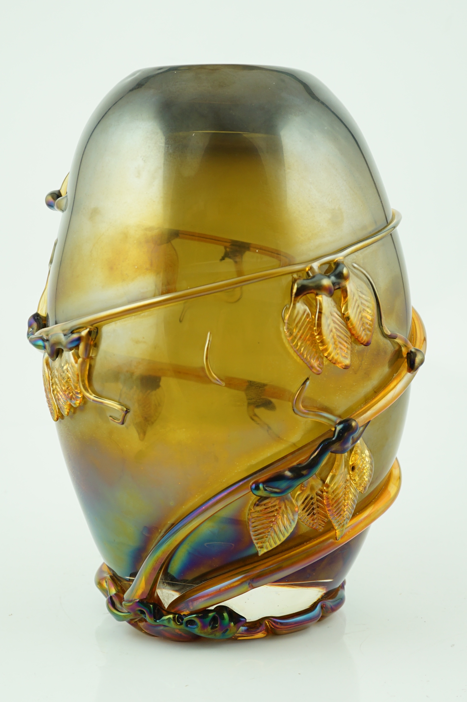 A Murano amber glass ovoid shaped vase, entwined with leaves